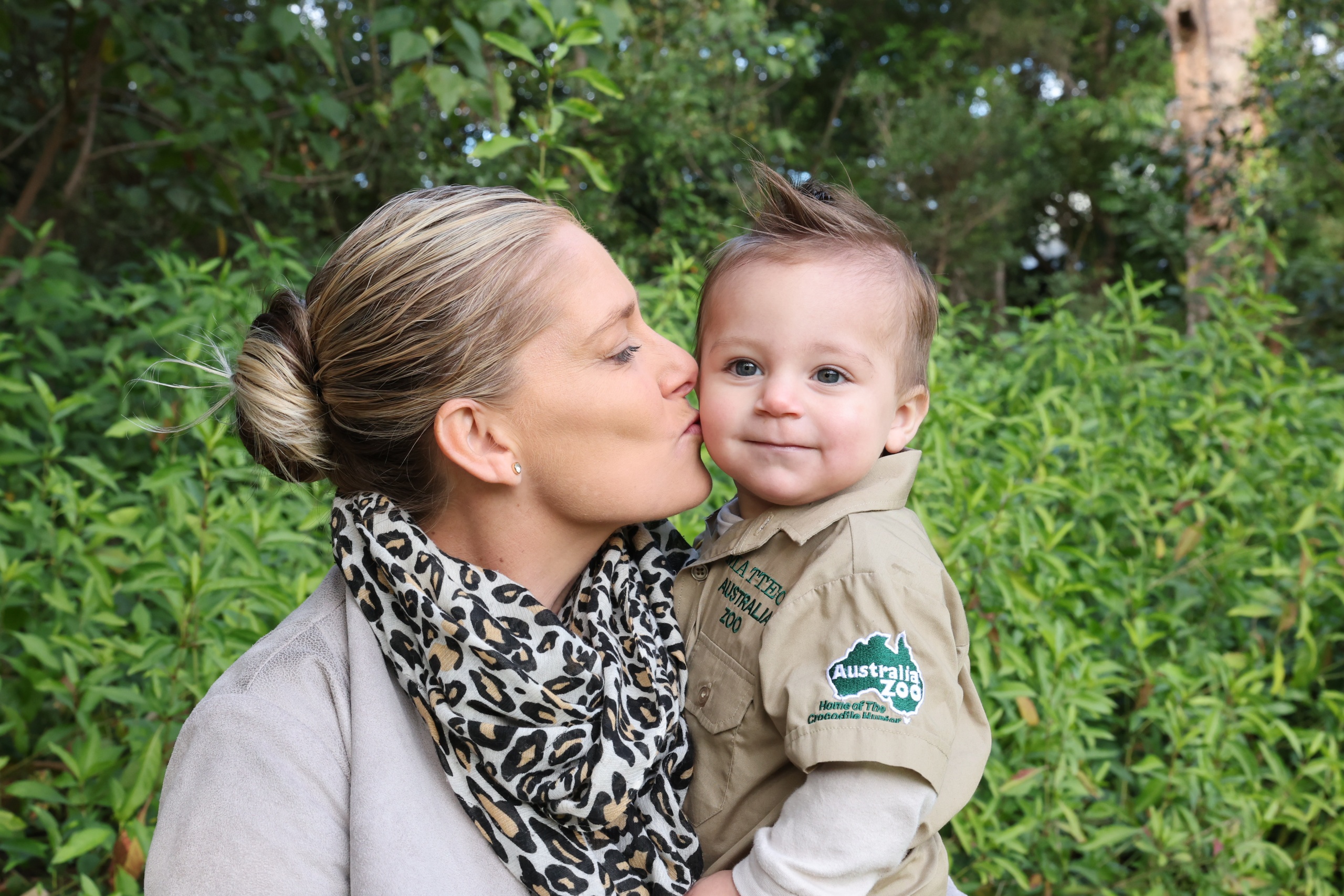 Lady kissing baby