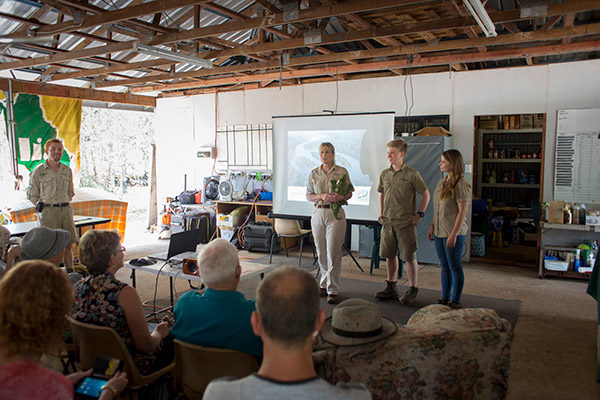 Terri, Robert, and Bindi in a classroom.