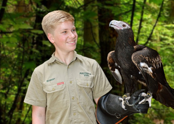 Robert Irwin with Ace the Wedge-tailed Eagle on his arm.