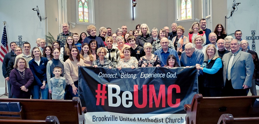 Members of Brookville United Methodist Church, Brookville, Indiana  pose in front of their #BeUMC sign. 