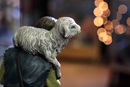 A nativity figure of a shepherd holds a young lamb. Photo by Kathleen Barry, UMNS