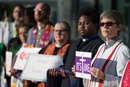 Protestors in support of LGBTQ clergy line the entryway to the 2016 United Methodist General Conference May 18 in Portland, Ore. Many wore or carried  clergy stoles of defrocked clergy. 