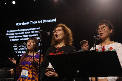 (From left) Julia Stukalova and Yulia Starodubets (Eastern Russia-Central Asia Provisional), and Marina Yugay (Northwest Russia Provisional) sing during the Feb. 23 morning of prayer at the 2019 Special Session of the United Methodist General Conference in St. Louis. Photo by Kathleen Barry, UM News