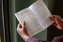 A man reads from Lenten study guide, 'Renegade Gospel: The Rebel Jesus' by Mike Slaughter.  Photo illustration by Kathleen Barry, United Methodist Communications.