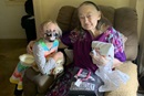Julia on a home visit with her friend, Mildred—who gifted her with a stuffed rabbit that belonged to her. (Photo courtesy of Kay Eskridge.)