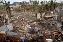 Survivors of Typhoon Haiyan pick through debris piled up by the storm in Tacloban, Philippines looking for their lost possessions. (A UM News photo by Mike DuBose.)
