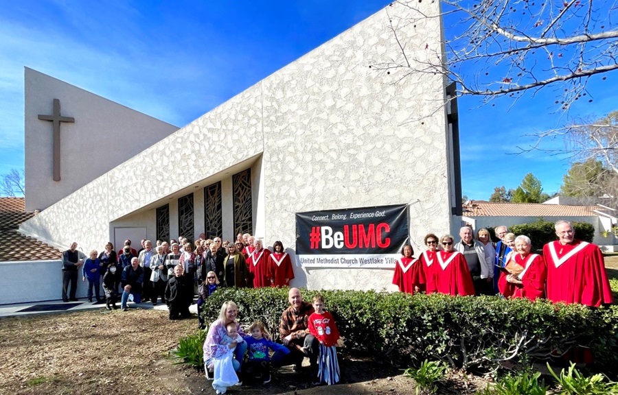 Members of United Methodist Church Westlake Village, Westlake Village, California pose in front of their #BeUMC sign. They received a grant from United Methodist Communications for the banner. 