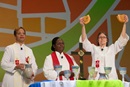 Bishops (from left): Bishop Tracy Smith Malone, Joaquina Filipe Nhanala and Sandra Steiner Ball consecrate the elements of Holy Communion during closing worship at the United Methodist Women Assembly 2018 in Columbus, Ohio. Photo by Mike DuBose, UMNS.