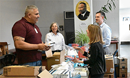  (Clockwise from left) The Rev. Carmelo Urena, Philadelphia Prisons head chaplain, works with EPA&GNJ members--the Rev. Marilyn Schneider, Eric Drew and the Rev. Dawn Taylor-Storm--to fill bags with donated toiletries to give to prisoners. John Coleman photo.