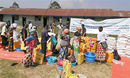 Recipients line up to receive vegetable oil, rice, salt, sugar and other aid distributed by The United Methodist Church in Beni, Congo. Money from the United Methodist Committee on Relief purchased 38 tons of food for displaced families in Beni. Photo by Chadrack Tambwe Londe, UM News.